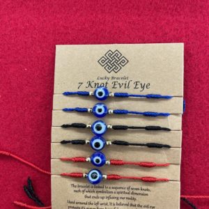 A card with six different colored evil eye bracelets.