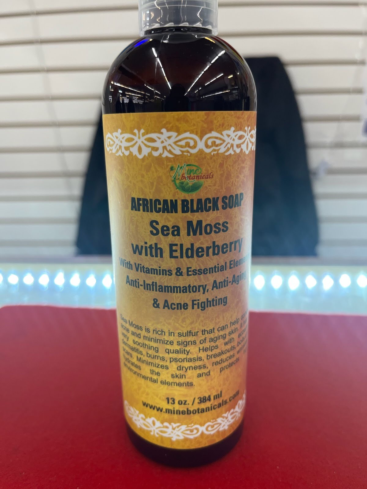 A bottle of african black soap with elderberry.