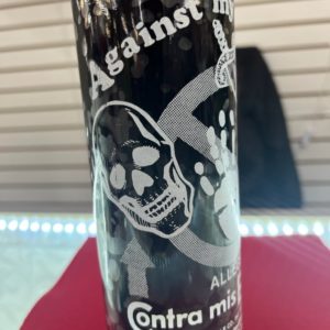 A can of beer with skulls on it.