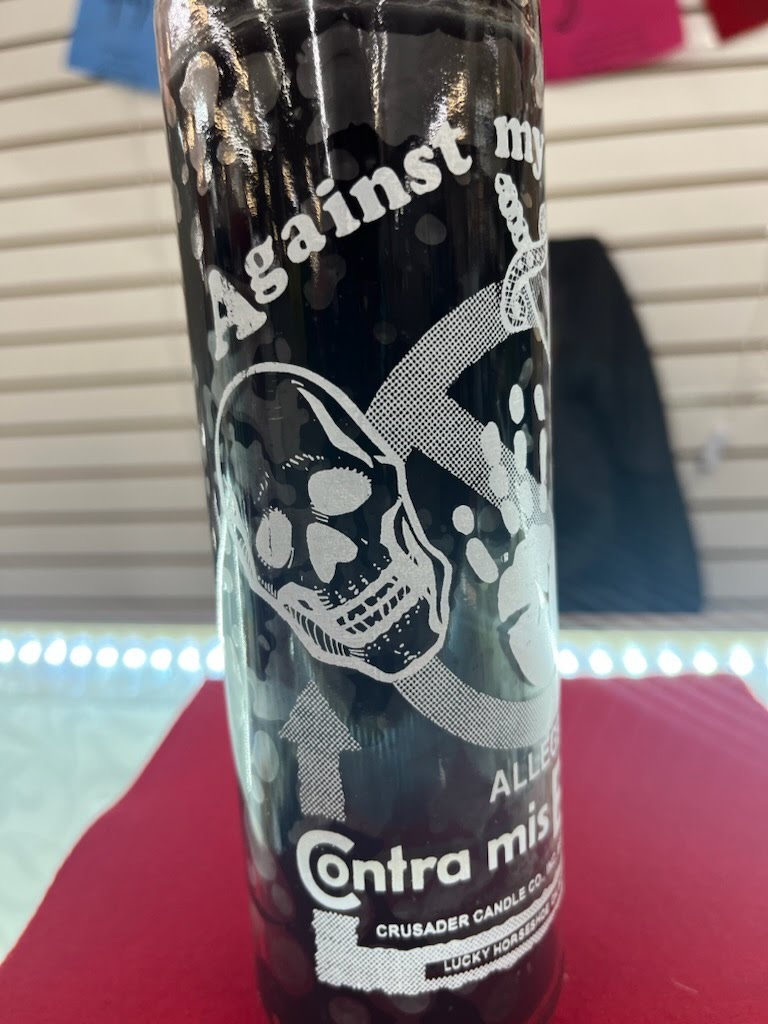 A can of beer with skulls on it.