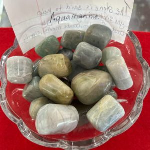 A bowl of rocks with a note on it.