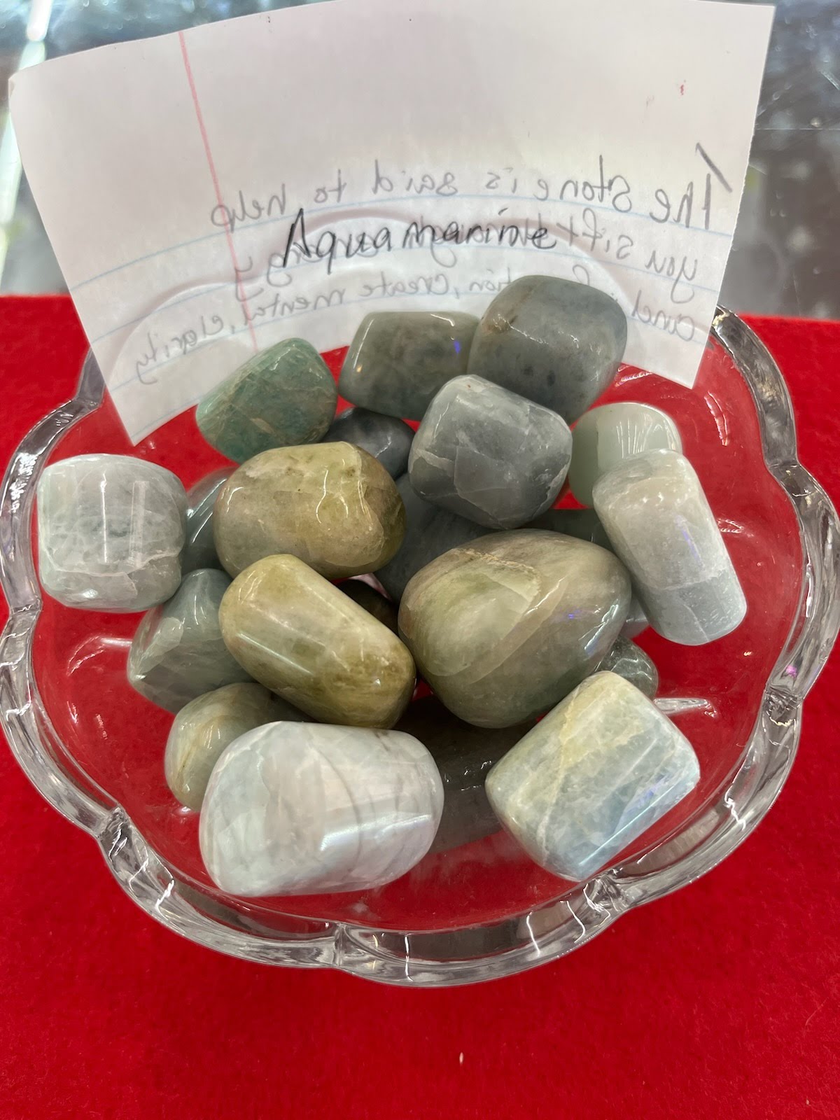 A bowl of rocks with a note on it.