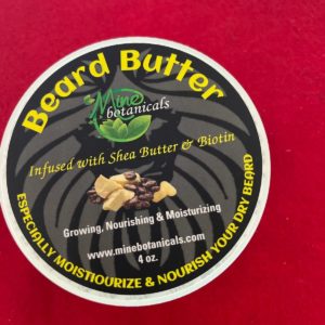 A red table with a label for a beard butter.