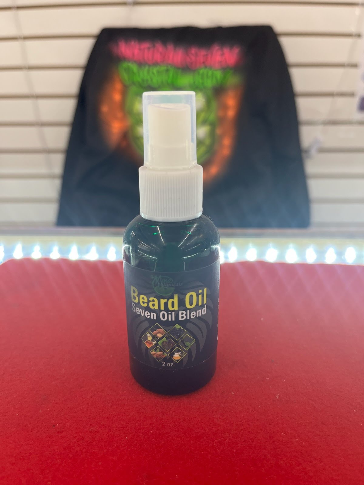 A bottle of beard oil sitting on top of a table.