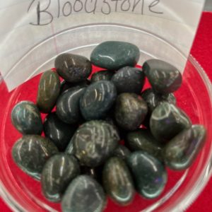 A bowl of blood stone is sitting on the table.