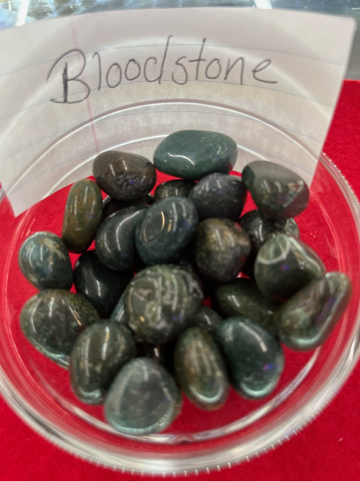 A bowl of blood stone is sitting on the table.