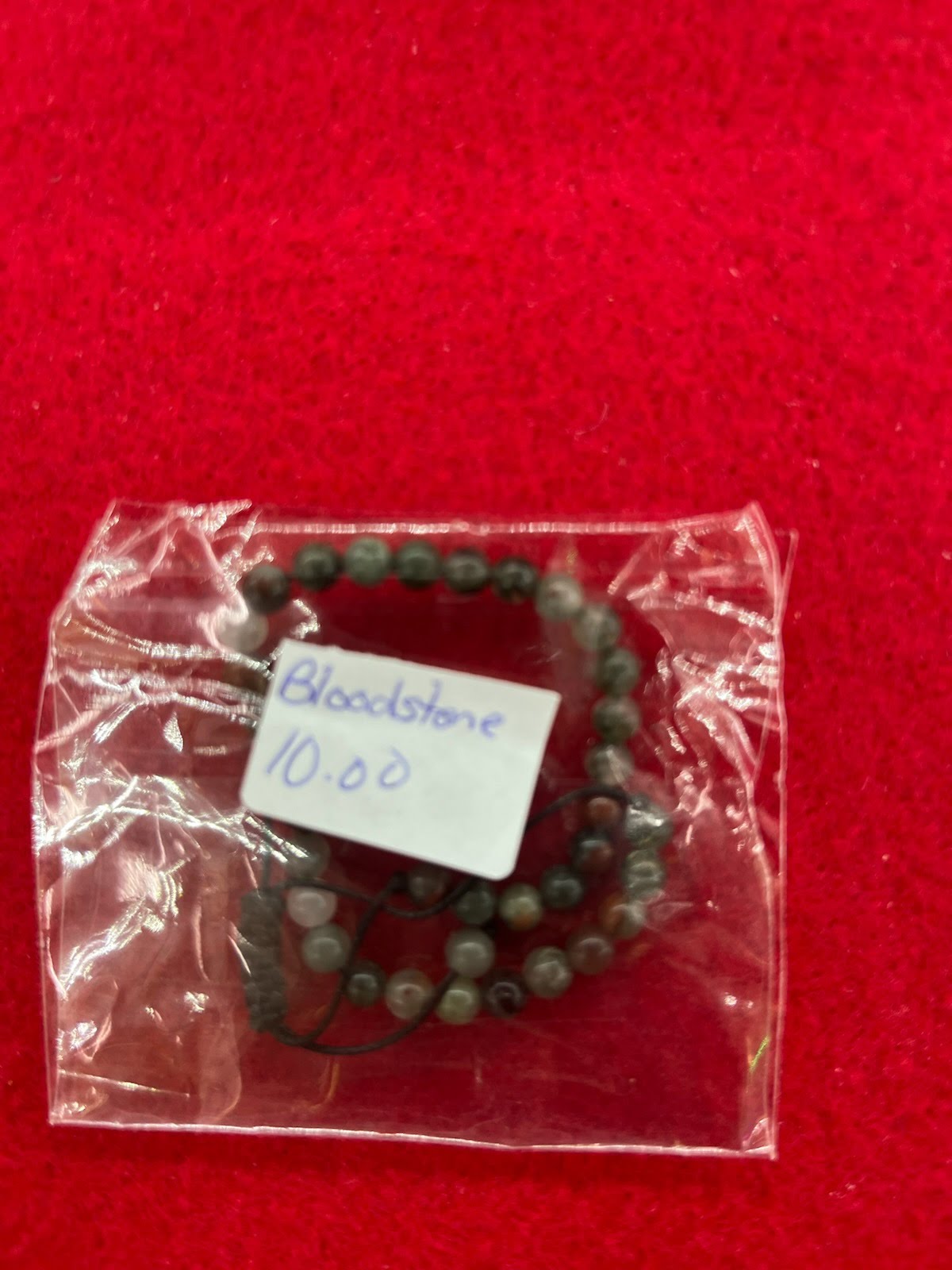A bag of beads with a tag on it
