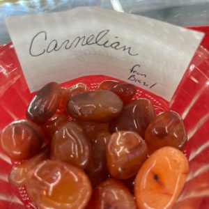 A red bowl of carmelian candy.