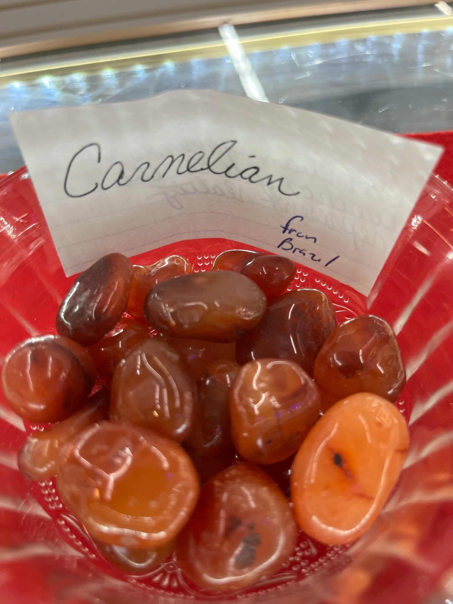A red bowl of carmelian candy.