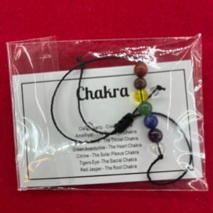 A bag of chakra beads with instructions.