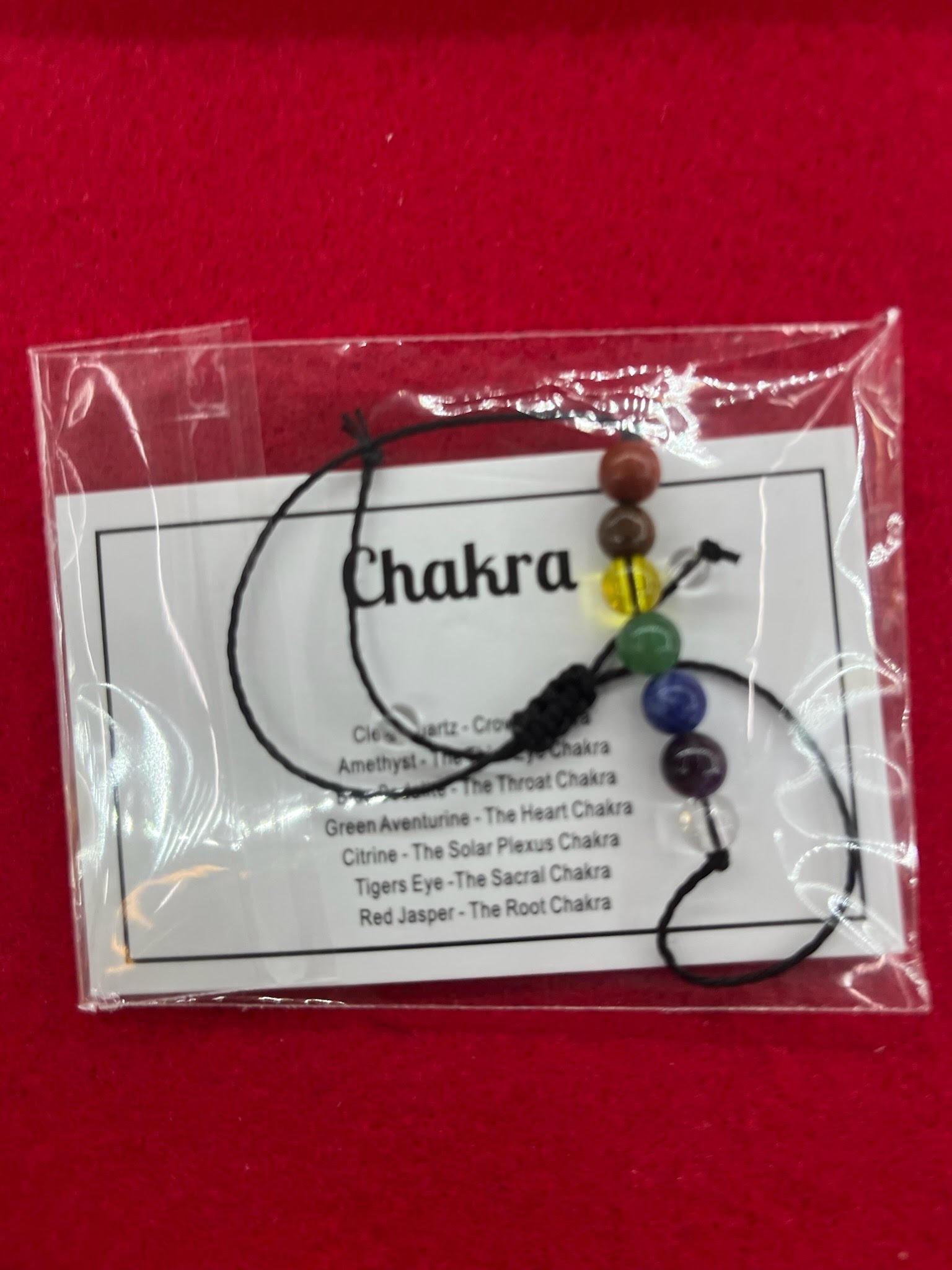 A bag of chakra beads with instructions.
