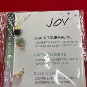 A package of jewelry with the word joy on it.