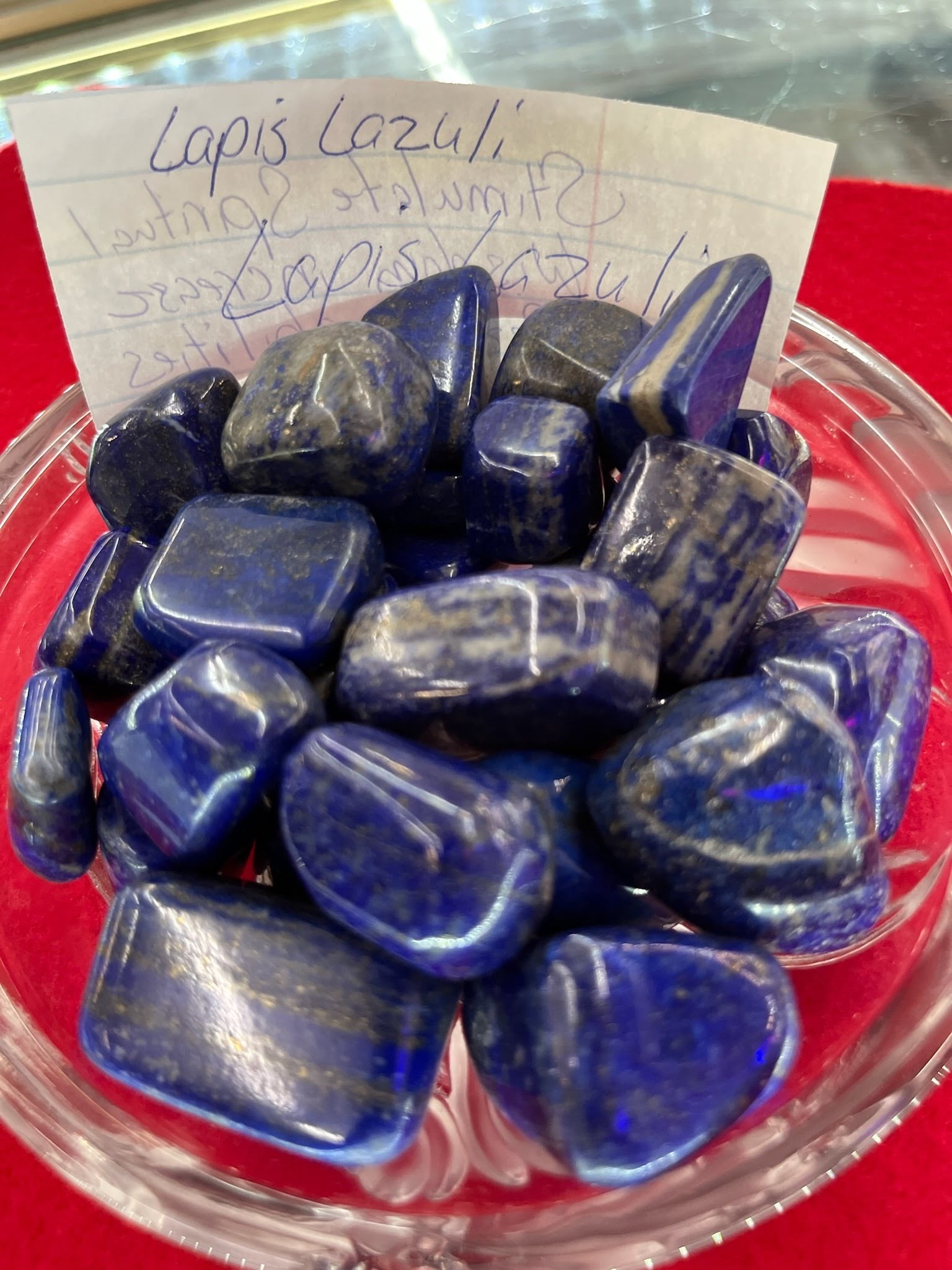 A bowl of blue stones on top of a table.