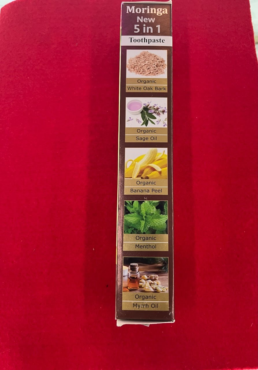 A red wall with a picture of different herbs.