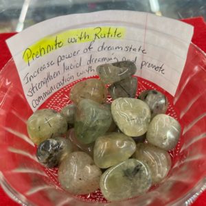 A bowl of rocks with a note on it.