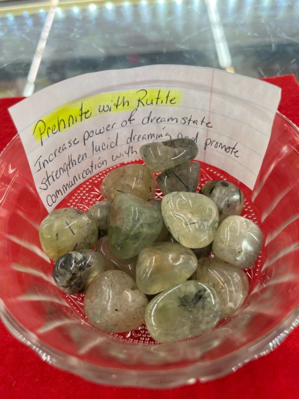 A bowl of rocks with a note on it.