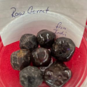 A bowl of raw chocolate covered carrots.