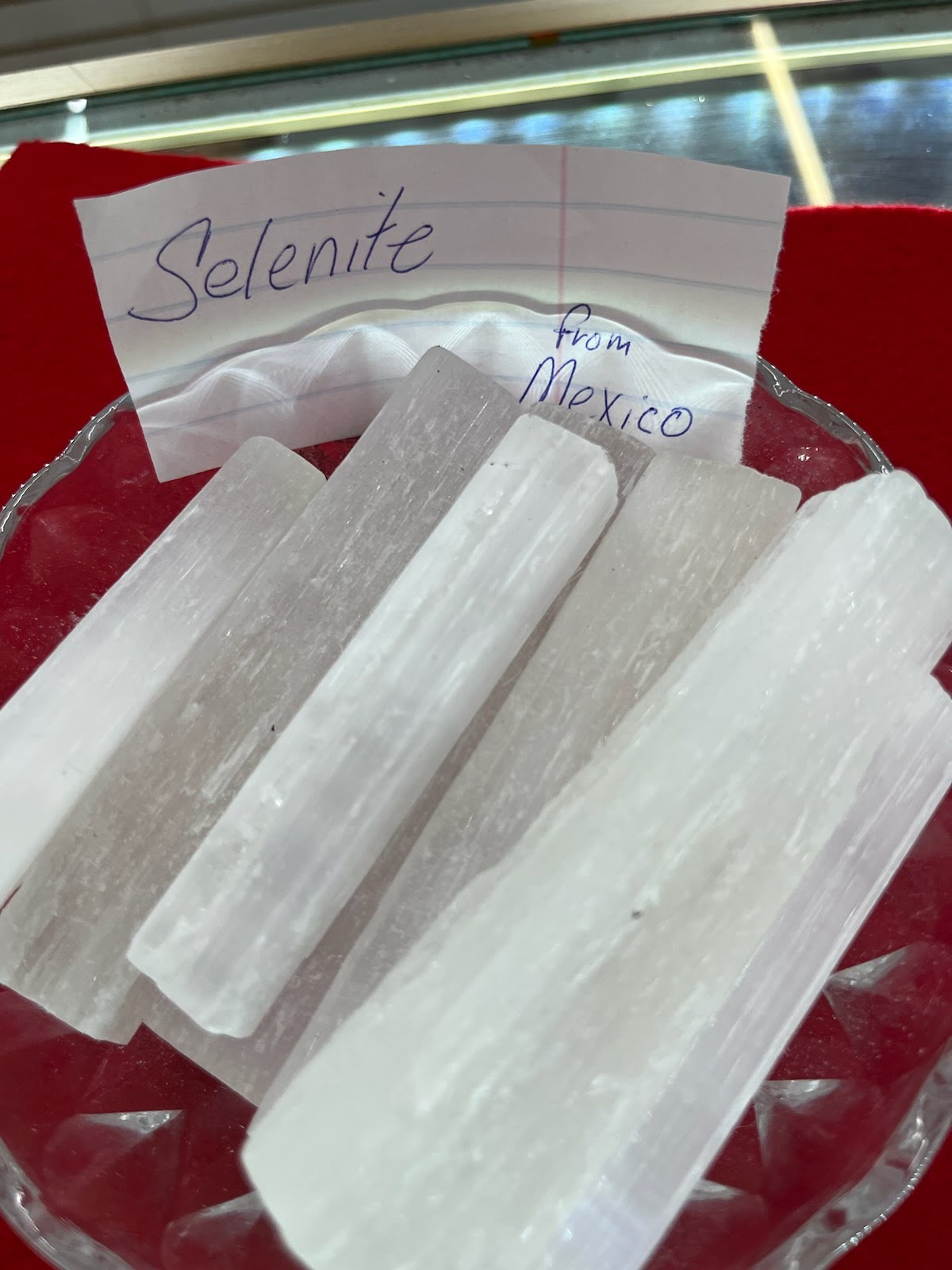 Selenite sticks are sitting on a plate.