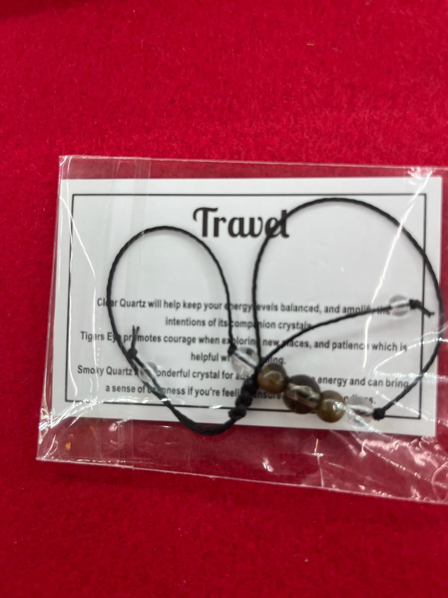 A bag of travel jewelry is shown on the table.
