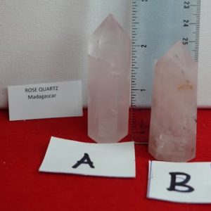 A pink quartz crystal and two other crystals