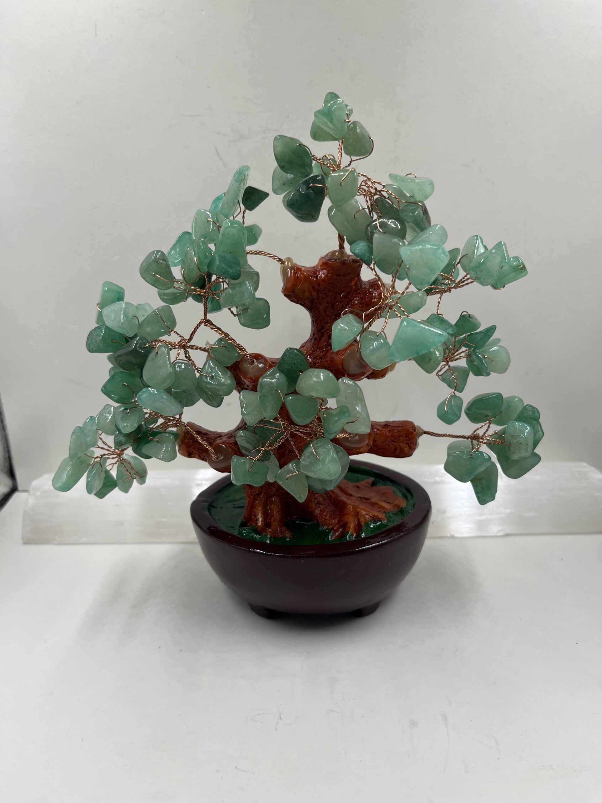 A bonsai tree made of green aventurine.