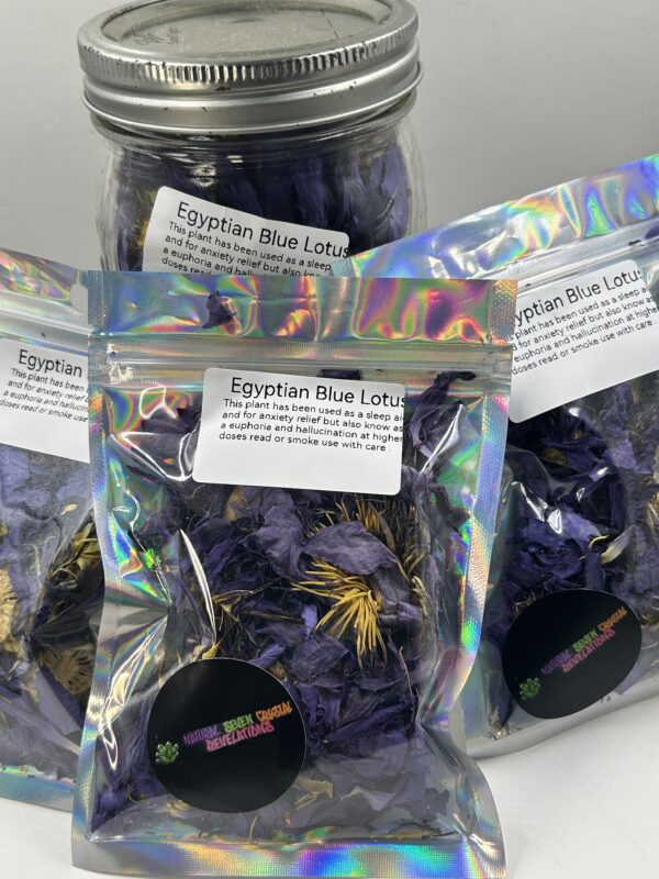 A jar of blue lotus flowers in front of three other bags.